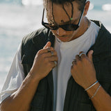Editorial shot of Billie Jo rings featuring natural textures and earthy tones.