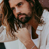 June 24 campaign featuring Billie Jo rings styled with natural materials.