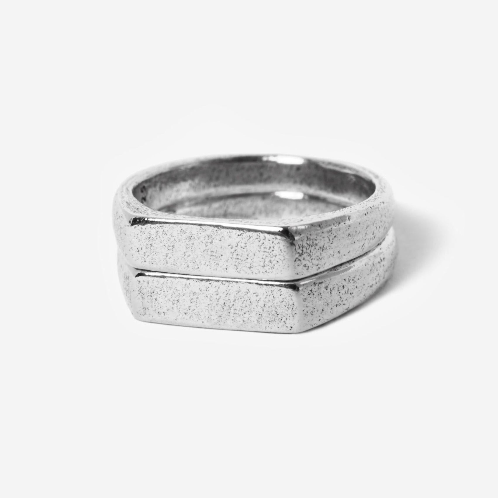 Hand holding koi fish pendant with soft light and blurred background