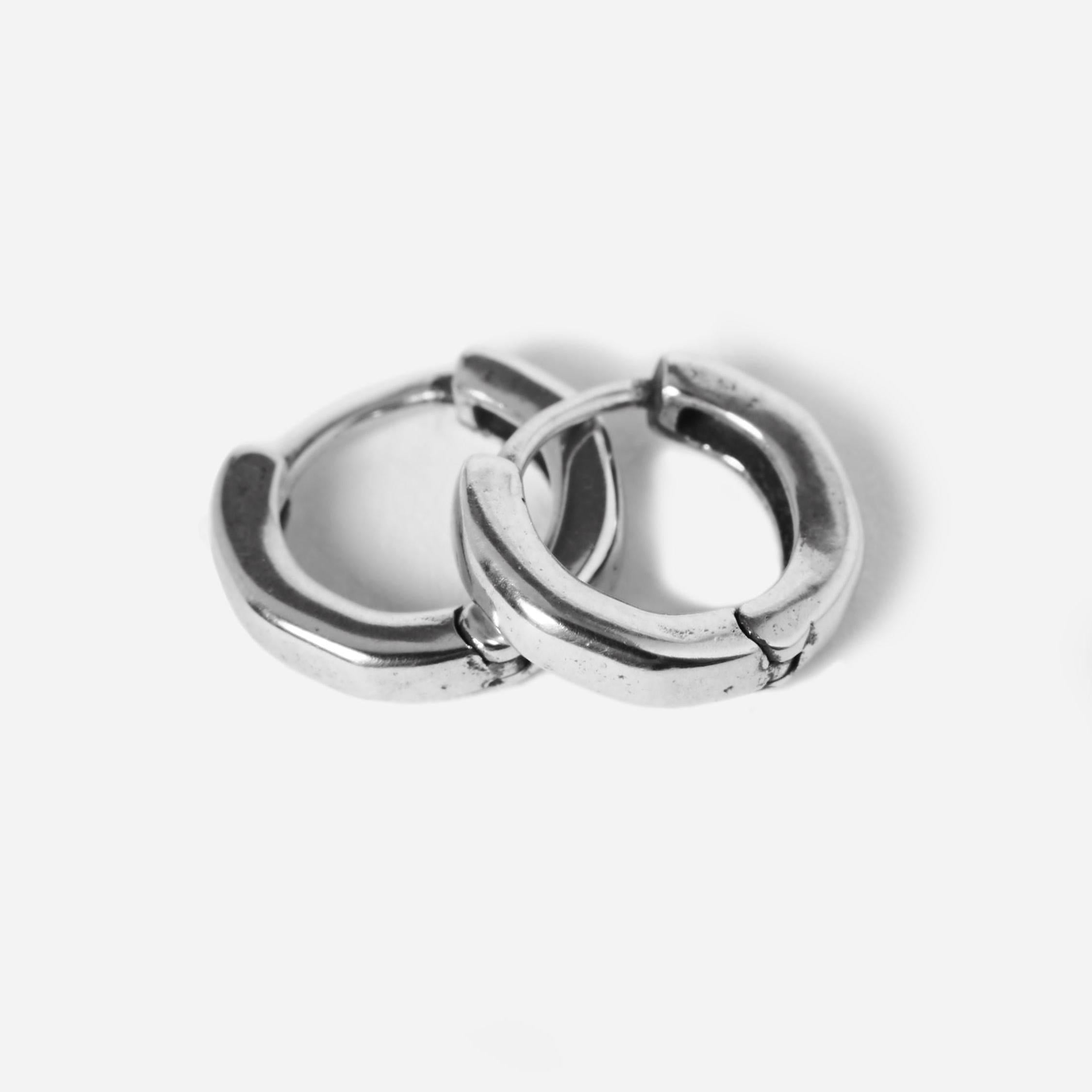 Flat lay of round earrings on white background v3