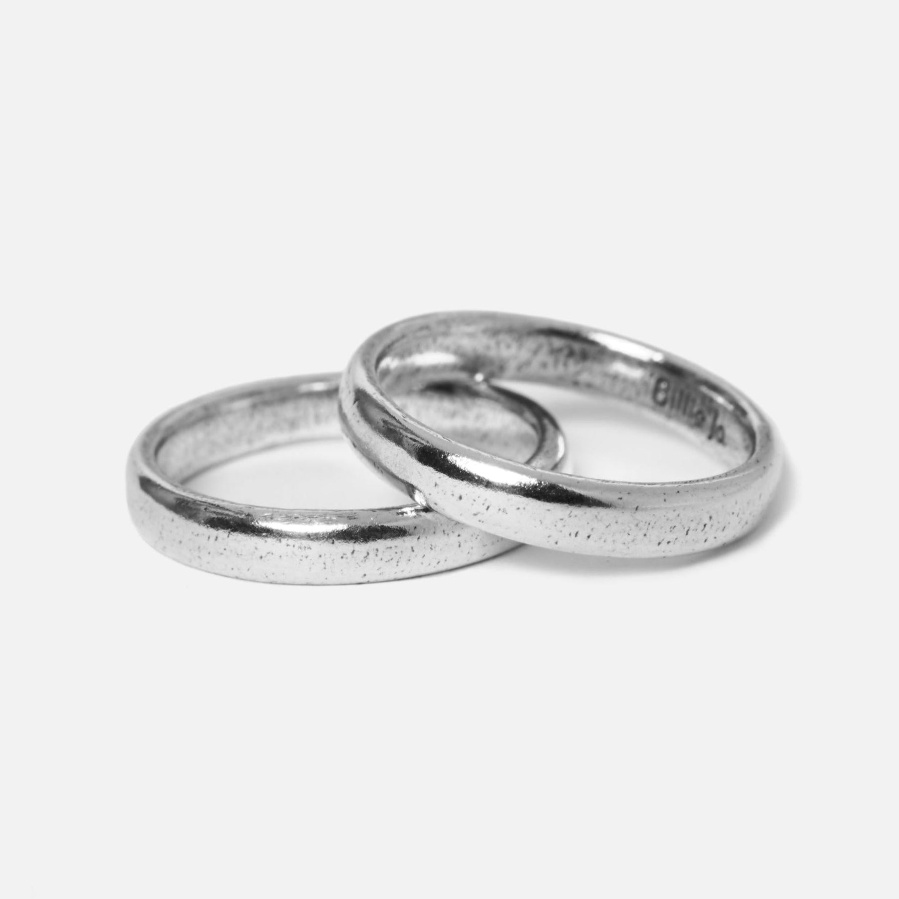 Stackable Billie Jo rings arranged for modern minimalist style.